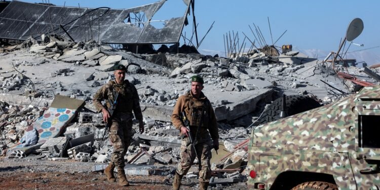 FILE PHOTO: Lebanese army soldiers secure a site that was hit by a strike, after Israeli jets hit Lebanon's Bekaa Valley for a second day on Tuesday, according to security sources, in Saraain, Lebanon March 12, 2024. REUTERS/Mohamed Azakir/File Photo